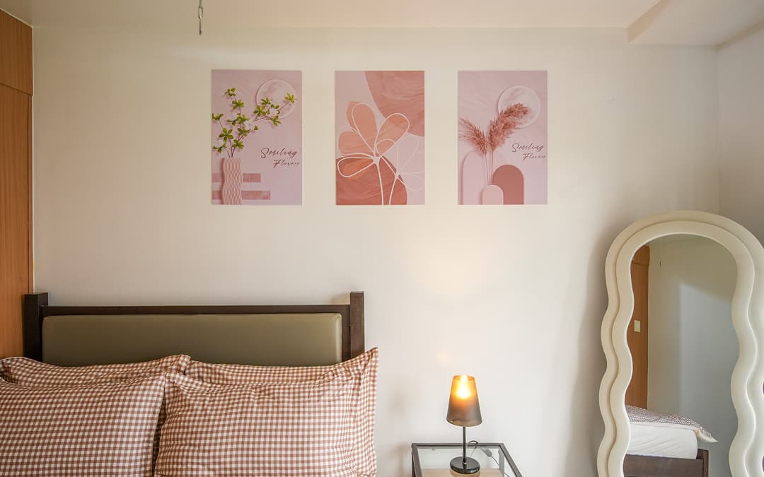 Cozy open-plan studio apartment with warm wood, neutral tones, and sunlight